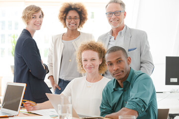 Portrait of office team smiling in conference room