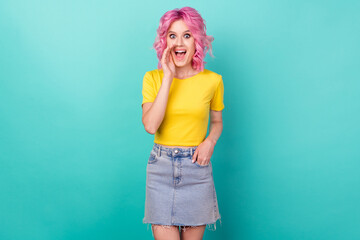 Photo of millennial funny pink hairdo lady tell secret wear yellow t-shirt skirt isolated on teal...