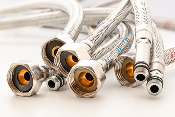 Flexible hoses. Plumbing hoses cold and warm water mixer connection to pipe tool accessories