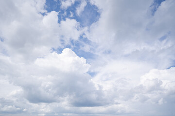 Naklejka na ściany i meble Natural background with blue sky and white clouds.