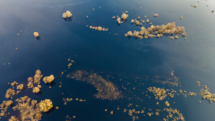 Aerial view of the lake or river with pattern wave. Water surface with ripples texture background. Viewed from above. Environment concept.