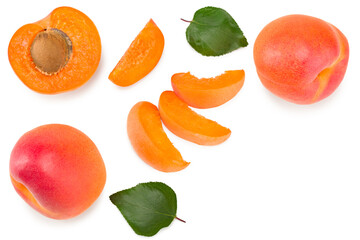 apricot fruits with slices and green leaf isolated on white background. clipping path. top view