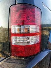 Dirty car headlights after a trip
