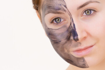 Woman with charcoal facial mask