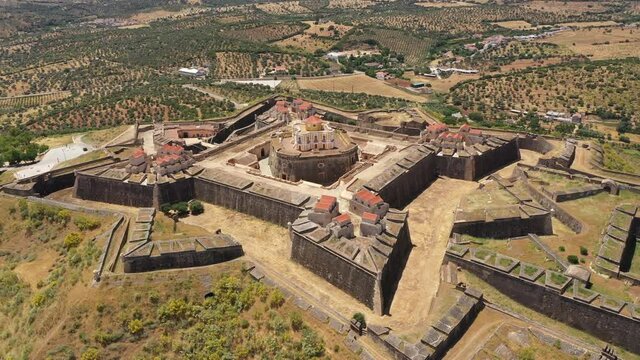 Rotating drone flight of spectacular star shaped Nossa Senhora da Graca fort in Elvas, historic architecture and cultural tourism in Portugal Europe
