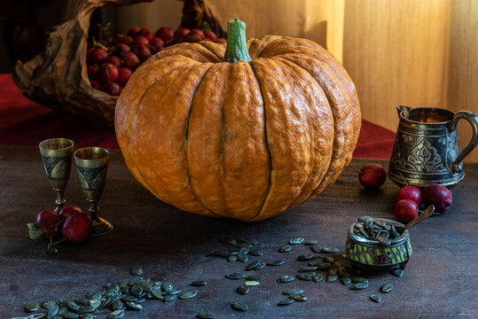 autumn still life. pumpkin, apples, seeda