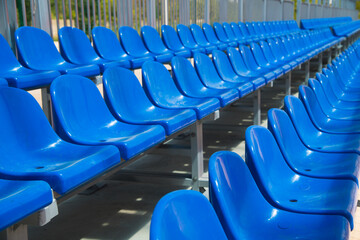 Naklejka premium Rows of empty blue plastic seats