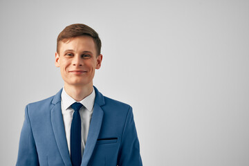 cheerful business man in suit gesturing with hand emotions posing studio
