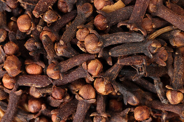 Fragrant dry clove but spice macro closeup top view pileup