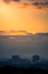 Aerial view of the city of Amsterdam, capital of the Netherlands on a calm summer evening, during cloudy sunset