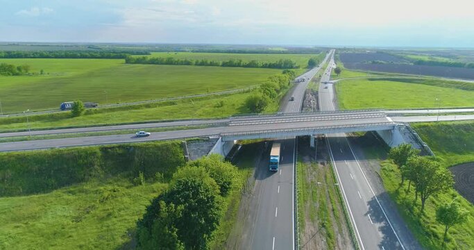 Traffic interchange top view. Ato go on the highway top view. Flying over a road junction. Cars drive along the highway outside the city
