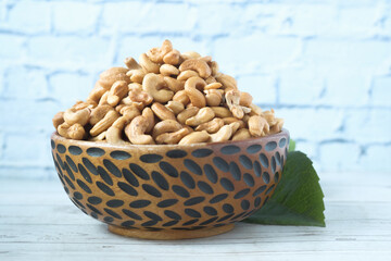cashew nut in a wooden bowl on table 
