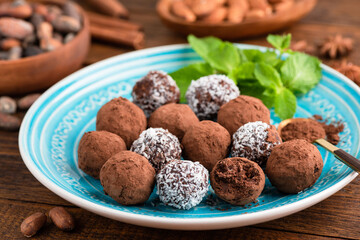 Homemade vegan coconut chocolate truffles, closeup view. Sweet food