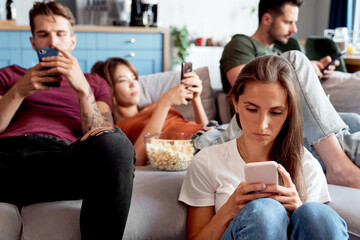 All friends focused on phones at party