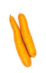 Two fresh carrots of small size lie on a white background