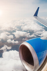 Fototapeta premium Spectacular view from the airplane window of the clouds in the sky - thick dense clouds of a thunderstorm front
