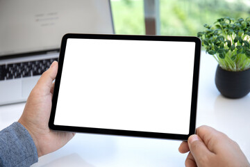 male hands holding computer tablet with isolated screen in office