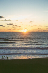 sunset on the beach. sunset over the ocean south west of France. blue and golden light in the sky.