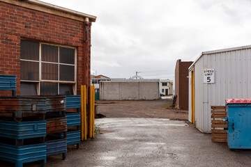 Entrance to industrial area with storage buildings.