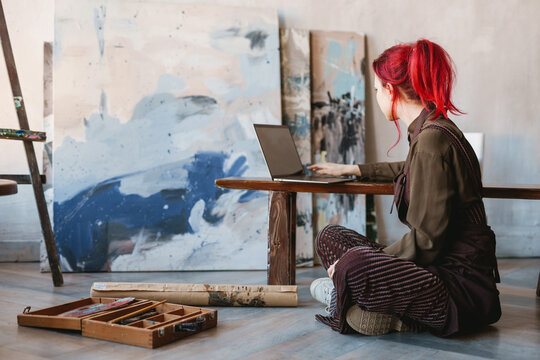Young white woman painter in an art studio