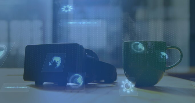 Image of scopes scanning on screens vr headset and green mug of hot tea