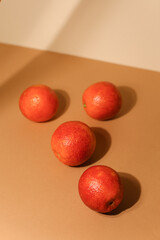Juicy dark tangerines on light background. Tasty fruits. Focus on front tangerine.