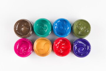 bottle of mixed color paints isolated on white background