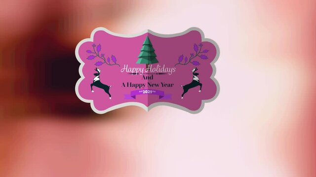 Animation of present tag with christmas greetings on brown background