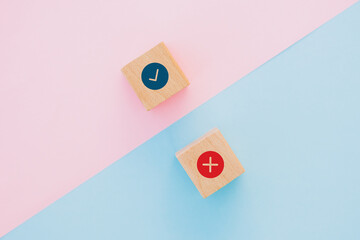 Wooden cube with signs YES or NO closeup