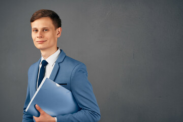 business man in a suit with documents in hands manager office work