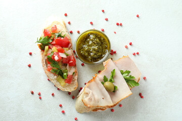 Delicious bruschetta snacks on white textured background