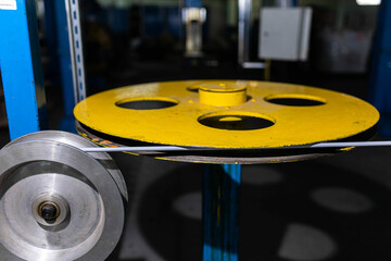 Fiber optic cable production machine, line in a factory in a workshop. Production of fiber optic...