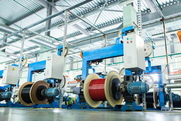 industrial production of fiber optic cable for telecommunication systems. Manufacturing of modern fiberglass and fiber optic cables at the factory.