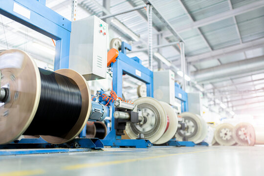 Industrial Production Of Fiber Optic Cable For Telecommunication Systems. Manufacturing Of Modern Fiberglass And Fiber Optic Cables At The Factory.