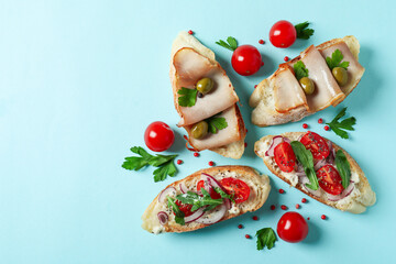Delicious italian snacks bruschetta on blue background