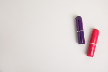 Tampons on light background, flat lay. Space for text