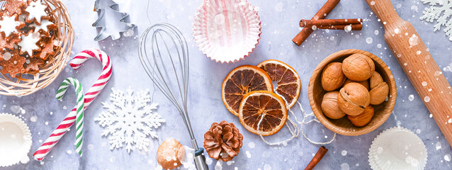 Christmas recipe food baking banner. Baking ingredients background, dishes, whisk, rolling pin, cookie cuttings, nuts, spices, top view, copy space, flat lay. Christmas baking concept