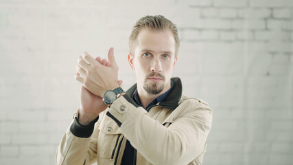 Man clap with hands with sarcastic serious expression