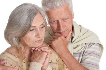 Close up portrait of sad senior couple