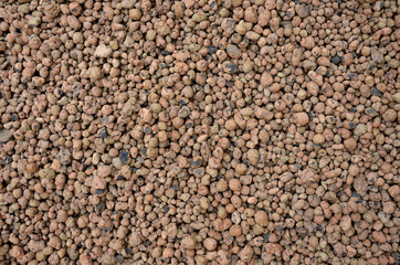 Lightweight expanded clay aggregate or expanded clay is a lightweight aggregate made by heating clay to around 1,200 °C in a rotary kiln. The yielding gases expand clay by thousands small bubbles