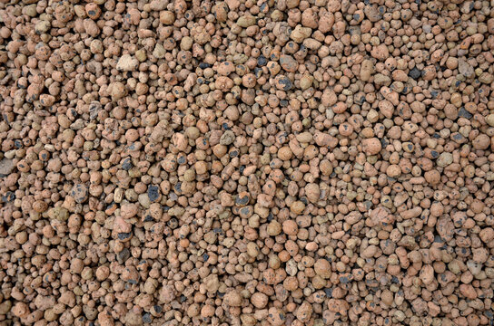 Lightweight expanded clay aggregate or expanded clay is a lightweight  aggregate made by heating clay to around 1,200 °C in a rotary kiln. The  yielding gases expand clay by thousands small bubbles