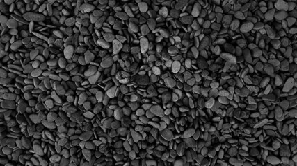 Street covered pebbles on sea coast. Rough uneven little bit fraction grunge marble terrace pathway. Summer smooth washed rustic stone. Scratched shabby grungy granite old rock for 3d seaside design