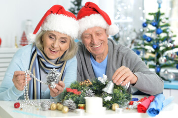 Close up portrait of seniors preparing for Christmas