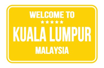 WELCOME TO KUALA LUMPUR - MALAYSIA, words written on yellow street sign stamp