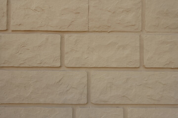 Closeup of pale yellow brick veneer wall
