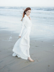 pretty red-haired woman in white dress lifestyle fresh air fashion travel