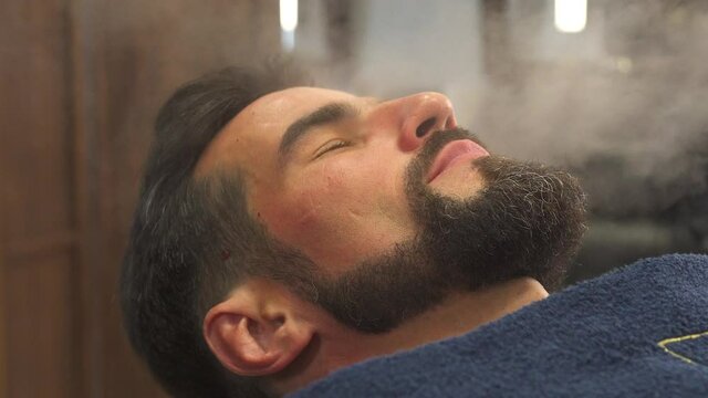 steam treatment of the face in a barbershop