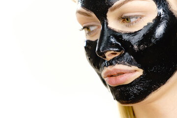 Girl black carbo peel off mask on face
