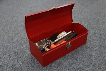 A red tool box that contains a lot of tools, this box makes it easier for workers to store their...