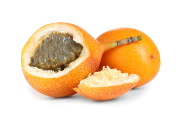 Whole and cut delicious granadillas on white background
